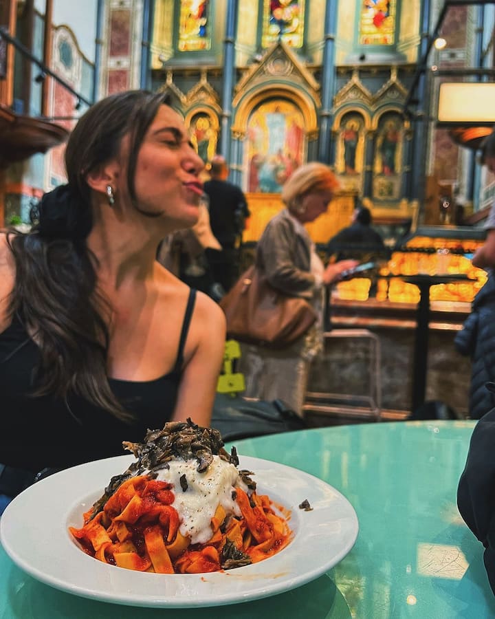 Another picture is a solo shot of Jankee enjoying a meal at a restaurant.