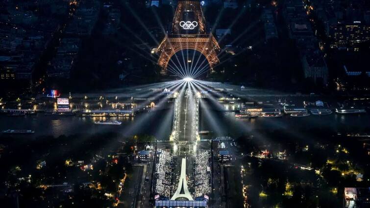 Paris Olympics 2024 kicks off with lavish boat parade  musical performances Paris Olympics 2024: చరిత్రలో నిలిచిపోయేలా, క్రీడా ప్రపంచం అబ్బురపడేలా