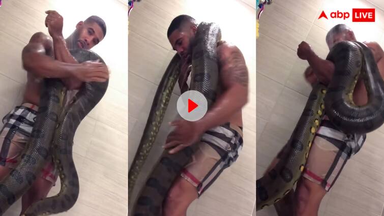 Man seen bathing in bathroom with dangerous python video goes viral Video: खतरनाक अजगर के साथ नहा रहा था शख्स, उसके बाद जो हुआ देखकर आपकी चीखें निकल जाएंगी