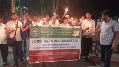 AMU में कर्मचारी की मौत के बाद कर्मचारियों ने निकाला कैंडल मार्च, प्रशासन पर लगाए कई गंभीर आरोप