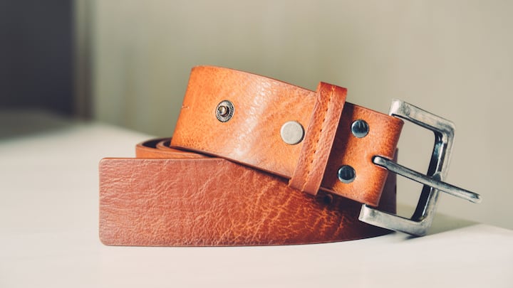 Belt: Gone are the days when belts were used only to tighten your pants or to keep them from sliding down. Now belts are used as a fashion accessory to elevate your outfit. It can be a classic leather statement belt that will make you look more stylish, or it can be a trendy piece that can be worn with your casual outfits. A belt can cinch your waist and add definition to your silhouette. If you wear a belt even on a 3-piece suit, it will automatically give a definition to your body figure. Choosing the right belt for the right outfit is also essential. A skinny and thin belt will look elegant on your dresses and skirts, but a wide and thick belt will cinch in your waist for a flowy or oversized dress. Buying belts that can be repeated multiple times, like neutral-colour belts, can be a feasible option as they can be styled on numerous outfits. (Image source: Canva)