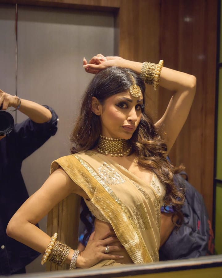 Mouni Roy, who is popular for her unconventional fashion choices, looked stunning wearing contemporary sarees.