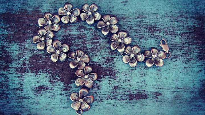 Start by investing in anti-tarnish pouches or airtight containers lined with soft fabric to shield your pieces from exposure to air, a primary cause of tarnishing.  (Image Source: Canva)