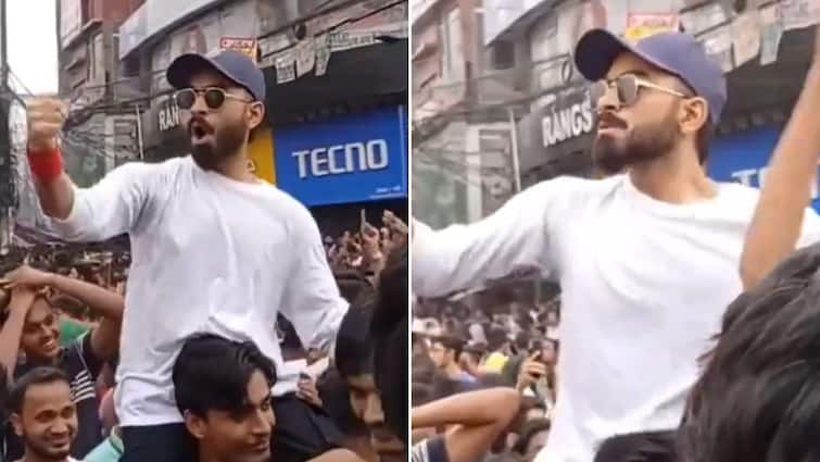 Virat Kohli Lookalike Bangladesh Protest Wearing RCB Cap Video Social Media Reactions Virat Kohli's Lookalike Wearing RCB Cap Amidst Bangladesh Protests Has Social Media Buzzing - WATCH