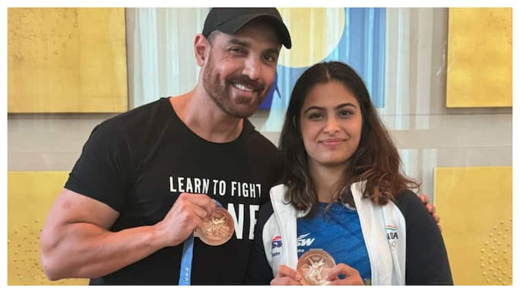 John Abraham Posts Pic With Olympic Medalist Manu Bhaker, Holds Her Medal, Gets Trolled John Abraham Posts Picture With Olympic Medalist Manu Bhaker, Netizens Are Not Happy