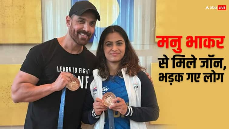 john abraham poses with paris olympic medalist manu bhaker netizens trolled actor to hold her medal जॉन अब्राहम ने ओलंपिक मेडलिस्ट मनु भाकर संग दिए पोज तो भड़के लोग, बोले- 'तुम्हें मेडल पकड़ने का हक नहीं है'