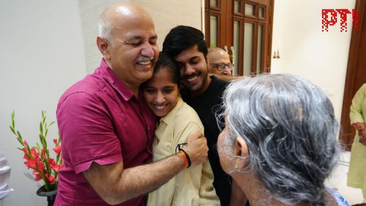 The AAP leader was seen hugging Kejriwal's children as he met them at their residence after his release. (Image Source: PTI)