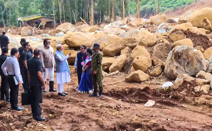Upon arriving in Chooralmala, Modi stepped out of his vehicle, engaged with rescue workers, state chief secretary V Venu, and district officials, and assessed the debris-covered area on foot. (Credit: PTI)