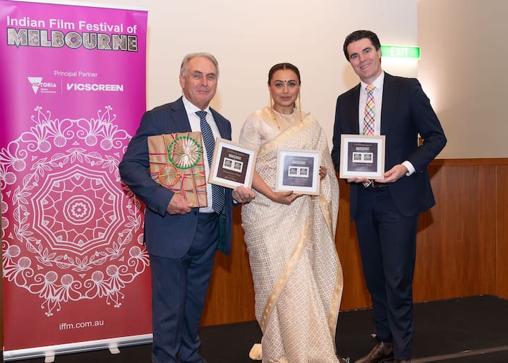 As part of the Indian Film Festival of Melbourne 2024, Rani Mukharjee launches a commemorative stamp that honours Yash Chopra, the legendary filmmaker's 50 years of filmmaking at the Australian Parliament. (Image source: Special Arrangement)