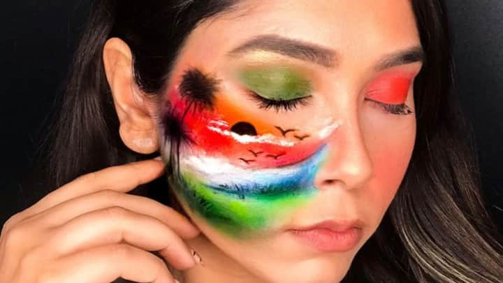 5. Flag-Inspired Face Paint: For the truly adventurous, incorporate small designs of the Indian flag on your cheeks or forehead using face paint. To complement this bold style, consider adorning your hair with small tricolour ribbons, hair clips or flowers for a complete patriotic ensemble. (Image Source: Pinterest/ Ishitta Chowdhary)