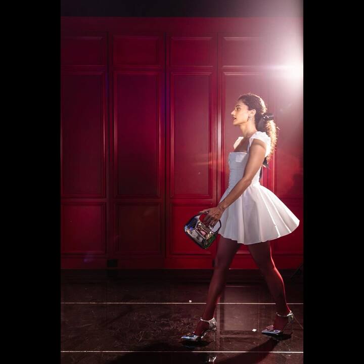 For her latest look, she wore a flowy white dress with a dramatic neckline.