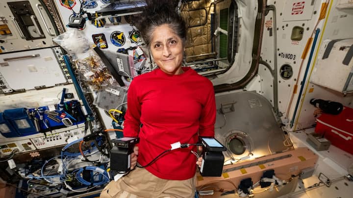 Sunita Williams inside the International Space Station's Unity module, displaying portable carbon dioxide monitors recently delivered aboard Northrop Grumman's Cygnus space freighter | Photo: NASA