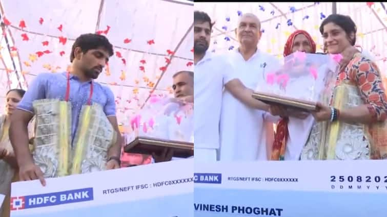 Vinesh Phogat and Olympics Bronze medalist Aman Sehrawat felicitated at a welcome ceremony in Jhajjar latest sports news Watch: झज्जर में विनेश फोगाट और अमन सेहरावत का ग्रैंड वेलकम, नोटों की माला पहनाकर किया गया स्वागत