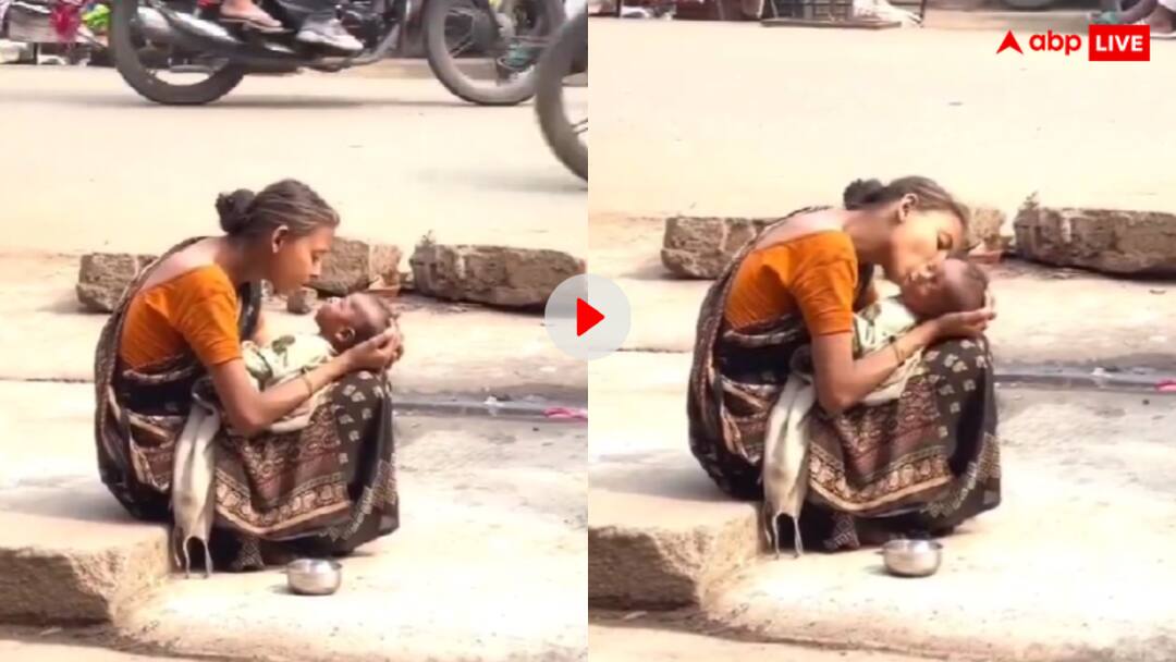 तपती दोपहर में बीच सड़क पर अपने लाल को दुलारती दिखी महिला, यूजर्स बोले- इस दुनिया में सबसे बड़ा योद्धा मां है Mother caressing her child in the middle of the road video goes viral तपती दोपहर में बीच सड़क पर अपने लाल को दुलारती दिखी महिला, यूजर्स बोले- इस दुनिया में सबसे बड़ा योद्धा मां है
