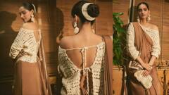 Sonam Kapoor Pics: बैकलेस ब्लाउज संग ब्राउन साड़ी पहन इठलाती दिखीं सोनम कपूर, स्टाइलिश लुक पर फिदा हुए फैंस