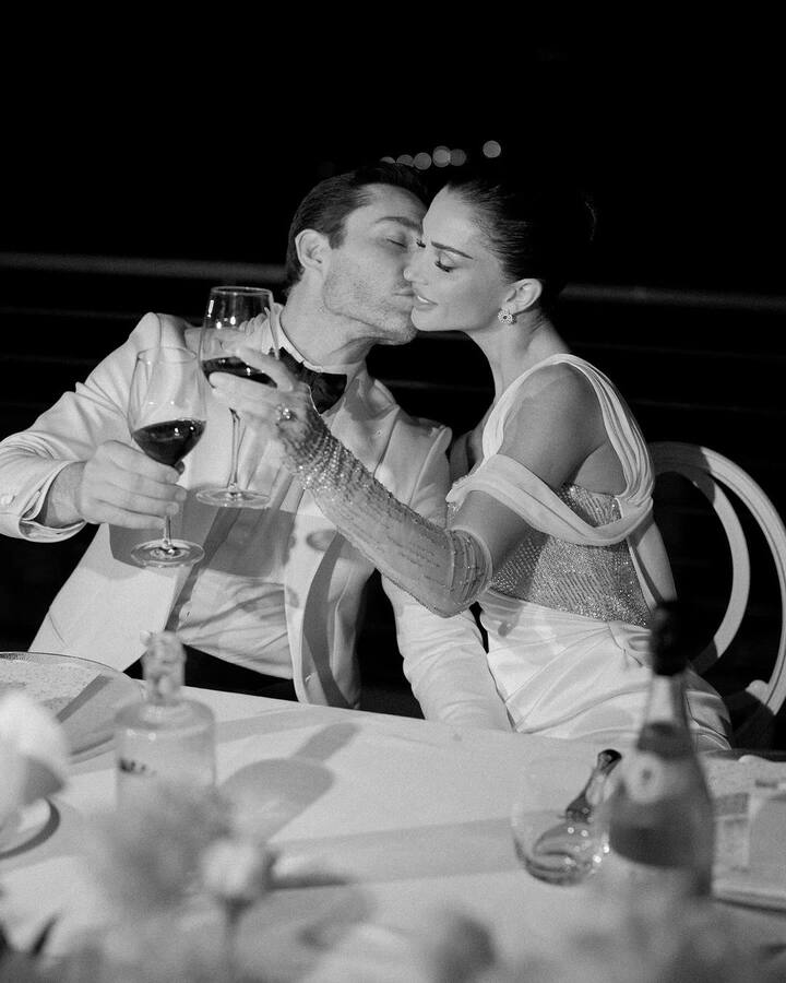 Her husband Ed stood by her, dressed sharp in a neat white suit and black bow tie, looking adoringly at her.