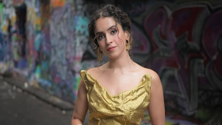 Sanya Malhotra exudes divine energy while wearing a golden saree and corset.