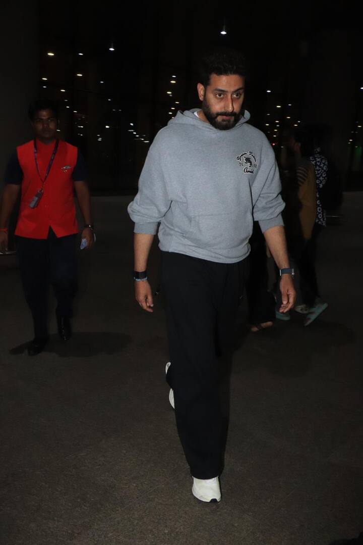 Abhishek chose a casual look with a grey sweatshirt, black pants, and matching shoes.