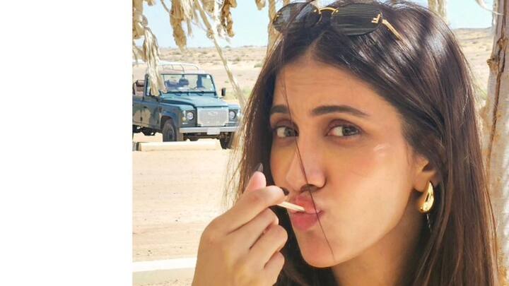 অন্যদিকে রুক্মিণী যে ছবি শেয়ার করে নিয়েছেন সেখানে তাঁকে দেখা গেল আইসক্রিম খেতে। মরুশহরে গিয়ে আইসক্রিমে মজেছেন তিনি।