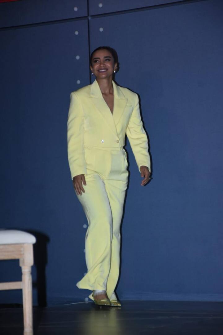 Patralekhaa in a yellow pant suit.