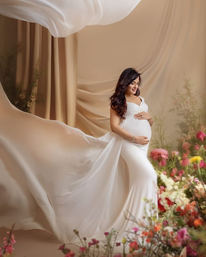 In the photos, Yuvika radiates with a pregnancy glow, cradling her baby bump with love and pride.