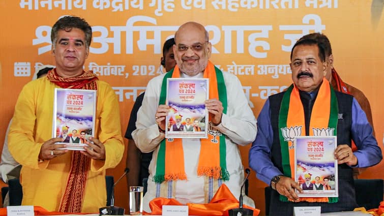 jammu kashmir election 2024 amit-shah-releases-bjp-manifesto-for-jammu-and-kashmir-polls-pm-modi-Ravinder-Raina J&K Poll: Shah Unveils BJP Manifesto; Rs 18,000 For Women, Rehabilitation For Kashmir Pandits Among Promises