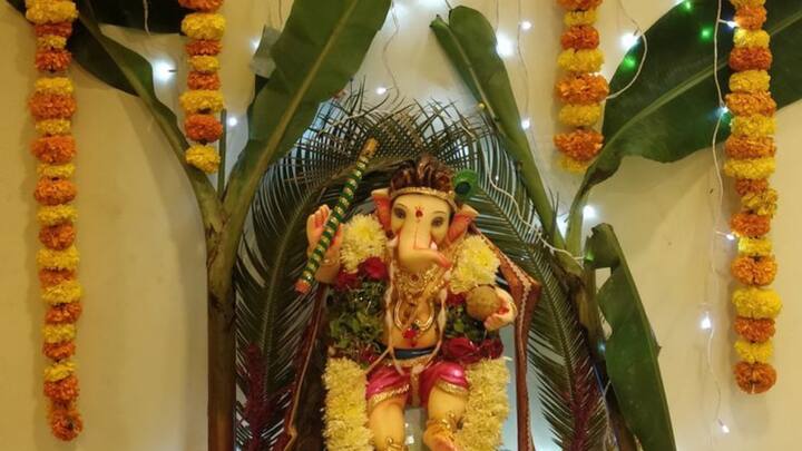 Nature's Harmony: Surround the idol with plants, flowers, or water for balance and abundance. (Image source: Pinterest/ ANUP Botkar)