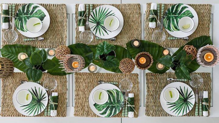 2. Adorn With Banana Leaves: These banana leaves when new can be used to enhance the appearance of a home especially in the dining area by using them as table runners. The leaves apart from having an aesthetic appeal bring the natural feel to your interior decor and are associated with good fortune. (Image Source: Pinterest/292rce8uceljo05pqvmre88zn8308g)