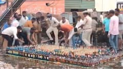 WATCH: Andhra Cops Line Up Seized Bottles Of Liquor Worth Rs 50L For Disposal, Locals Run Away With Them