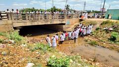 கால்வாயில் இறங்கி விவசாயிகள் போராட்டம்: கஞ்சி காய்ச்சி குடித்து காத்திருப்பு போராட்டம்