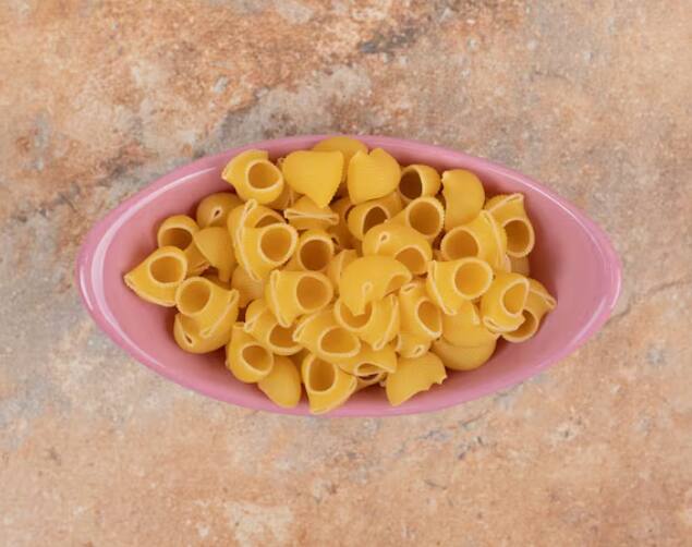 Now take out the cooked macaroni in a plate and serve it to your kids with tomato sauce, toppings or cheese.