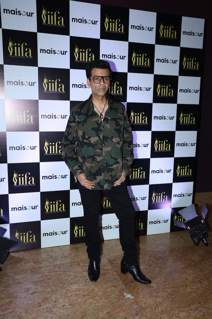 Filmmaker Karan Johar emitted flair in a camouflage shirt, paired perfectly with black pants and black shoes.