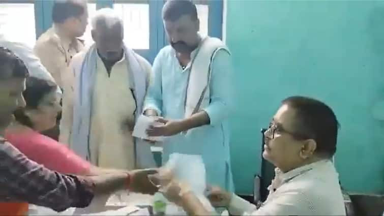 Viral Video BJP MLA Manju Tyagi Snatches Poll Papers From SDM Akhilesh Yadav Takes Bulldozer Dig At UP CM Yogi BJP MLA Manju Tyagi Snatches Poll Papers From SDM, Akhilesh Yadav Takes 'Bulldozer' Dig At UP CM Yogi: VIDEO