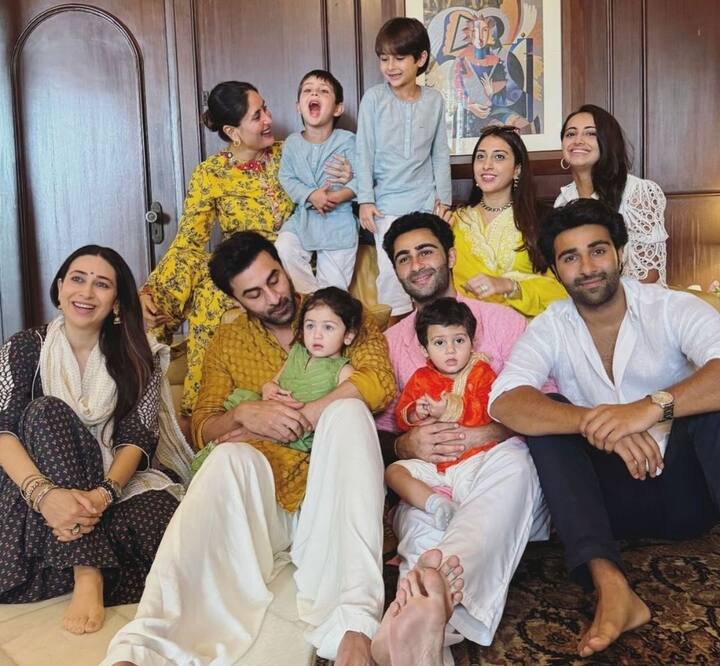 In the first photo, the Kapoor family posed together for a group portrait, with Ranbir standing behind Randhir Kapoor while holding baby Raha. Kareena sat at the far left, with Jeh on her lap.  The second picture captured Raha curiously looking beyond the frame as she sat on Ranbir’s lap, while Jeh flashed a big grin, dressed in a light blue kurta matching his elder brother Taimur.