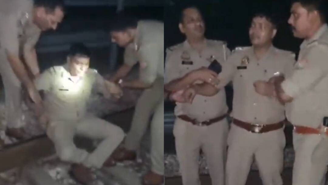 Aligarh Cop Attempts To End Life Over Harassment By Judge, Rescued From Railway Track: On Cam Aligarh Cop Attempts To End Life Over Harassment By Judge Rescued From Railway Track viral video Aligarh Cop Attempts To End Life Over Harassment By Judge, Rescued From Railway Track: On Cam