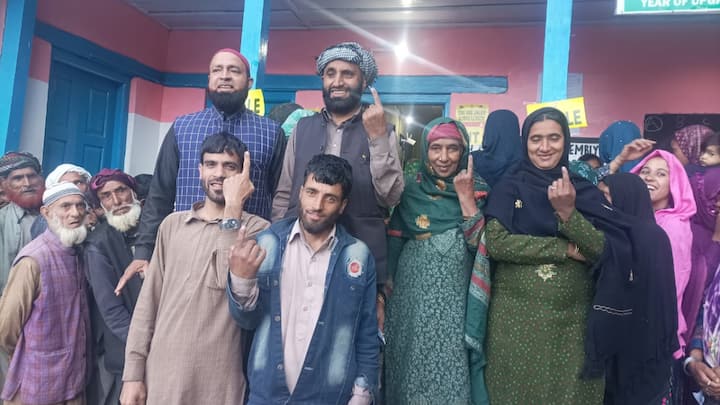 A group of people with inked fingers pose for a photograph at a polling station in Kishtwar. The voting process that began at 7 am will conclude at 6 pm. (Photo:@ceo_UTJK)