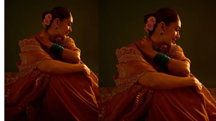 மஞ்சள் சேலை, தலையில் சாமந்தி பூ ,பச்சை நிற வளையல் என கலர் காம்பினேஷனாக உள்ளது.ஒட்டுமொத்த அழகையும் மேம்படுத்த அழகான மூக்குத்தி டிசைன் அனைவரையும் கவர்கிறது