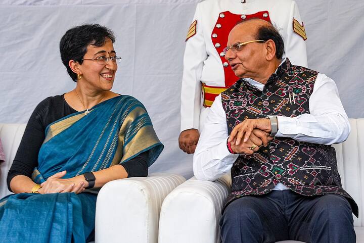 The new Delhi Cabinet headed by Atishi has a long list of pending projects, schemes and new initiatives to be launched in the next few months. In this photo,  Delhi Lt. Governor V.K. Saxena with CM-designate Atishi during her swearing-in ceremony, at Raj Niwas. (PTI Photo)