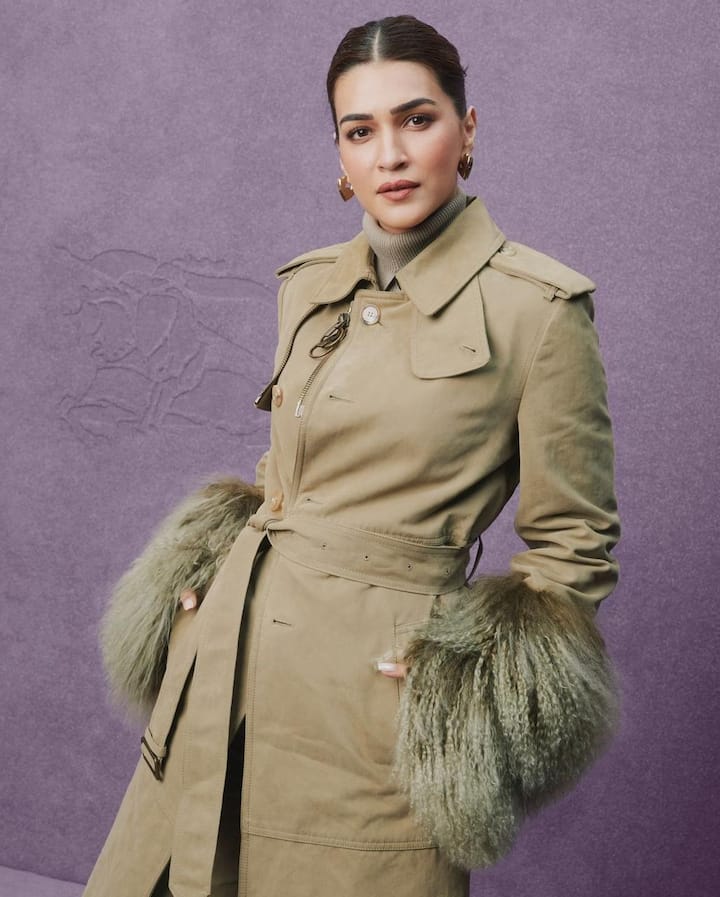 In a picture the actress is seen wearing a trench coat which is draped around her sleeves with added drama from the faux fur sleeves. (All Image: Kriti Sanon/Instagram.)