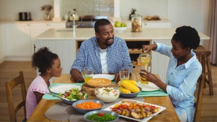3. Seating Arrangement: The head of the family should sit facing the east or north direction, which is said to bring prosperity and health. Other family members can sit facing east, north, or west, but it’s advisable to avoid facing south while eating, as this direction is believed to cause discomfort or health issues. Equal and comfortable seating for everyone encourages harmony and togetherness in the family. (Image Source: Pinterest/creativemarket)