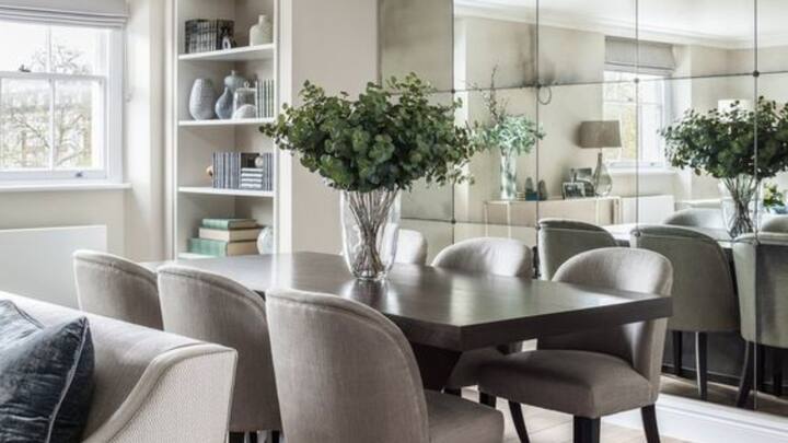 5. Mirror Placement: Placing a mirror in the dining room, especially on the north or east wall, is considered auspicious in Vastu. The reflection of the dining table in the mirror is believed to multiply prosperity and abundance. However, avoid placing mirrors that reflect clutter or negative elements, as this can invite unwanted energy. (Image Source: Pinterest/rougholdglass)