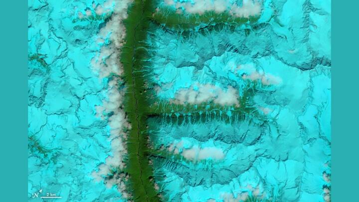 'F' FOR REAL: The Operational Land Imager (OLI) aboard Landsat 8 captured this vivid false-color image on August 4, 2014, showing snow-covered mountain ranges and valleys in southeastern Tibet. Firn, a granular type of snow, appears on the surface before compressing into ice. Photo: NASA