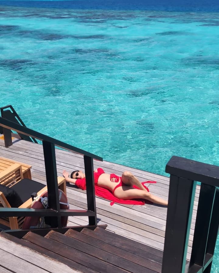 Mouni is seen soaking the sun in a red bikini.