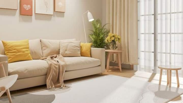 2. White Rugs: Pairing white rugs with nude curtains creates an effortlessly elegant look that works in any season. The subtle contrast between them adds warmth and light to your space, giving it a timeless, chic feel. (Image Source: Pinterest/ezerlivingcom)