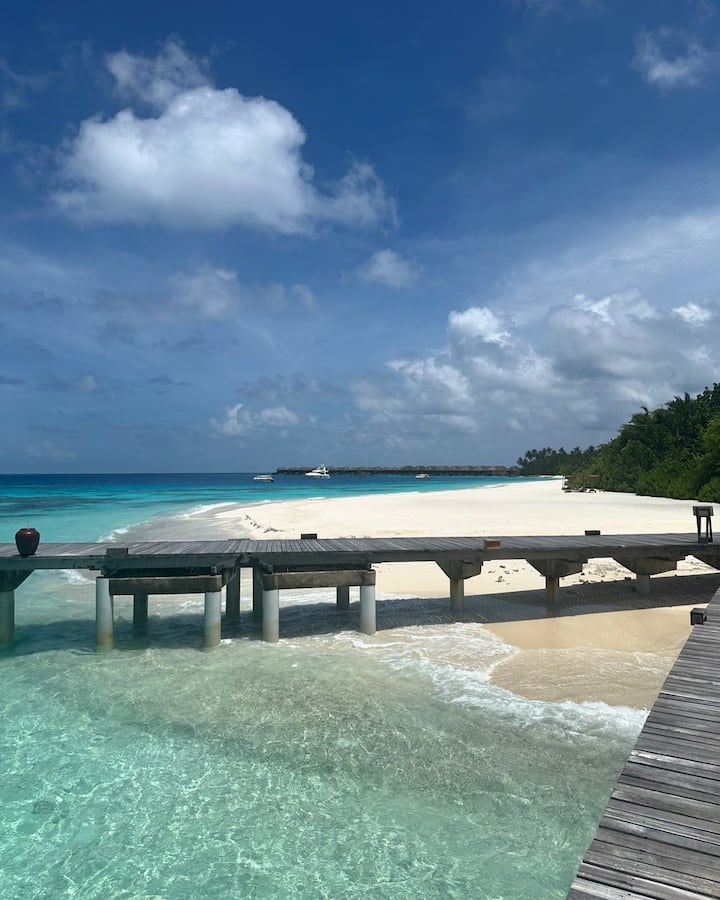 Mouni showcases a picturesque view of the sea while capturing the beauty of the resort.