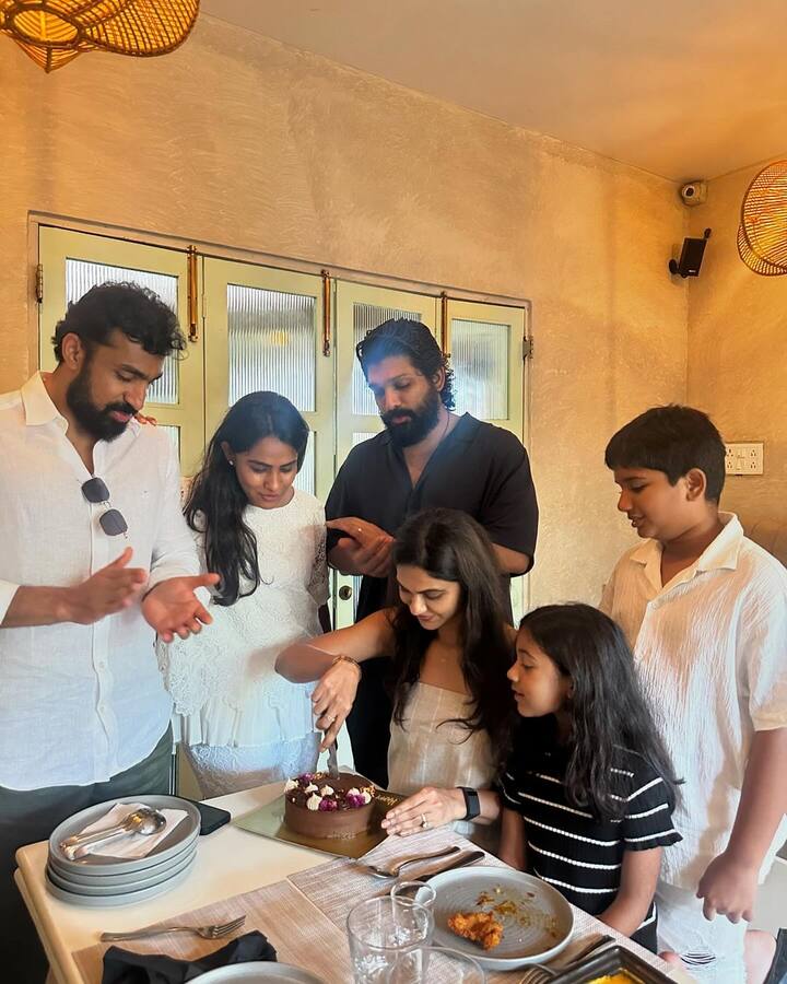 In one picture, Sneha poses with Allu Arjun and their kids, wearing a white co-ord set. Another shows her cutting a chocolate cake while family and friends cheer.