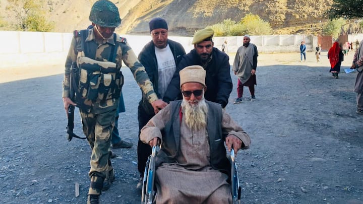 An elderly voter is helped by security personnel and volunteers at a polling station. PM Narendra Modi on Tuesday urged the people of Jammu and Kashmir to come forward to vote in the third and final phase of the Union territory’s assembly election. (Photo:@ECISVEEP)
