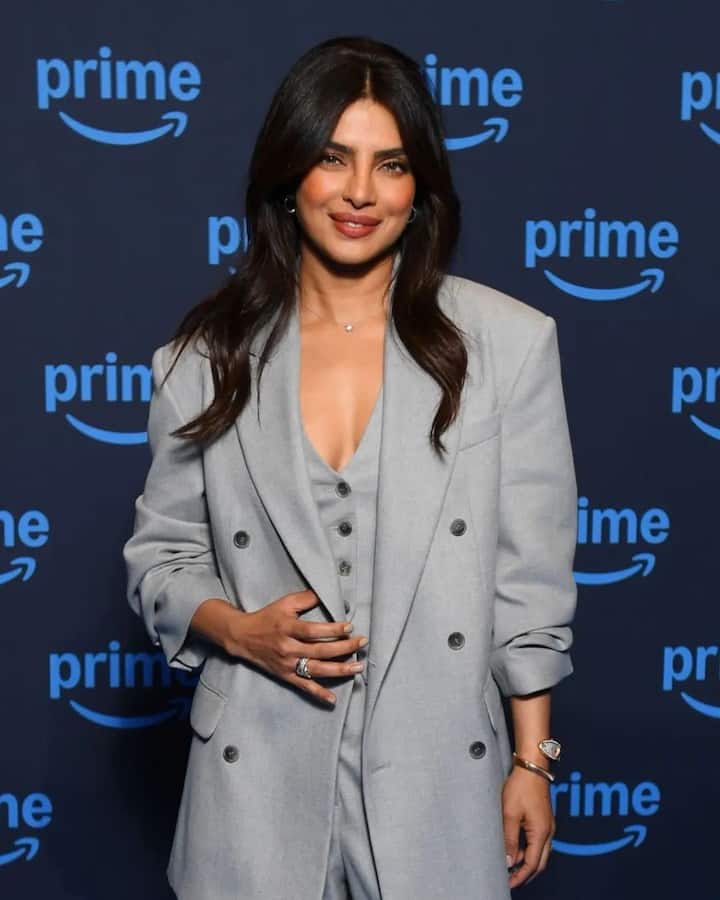 The straight-fit trousers completed her chic, monochrome look, showcasing her polished style.