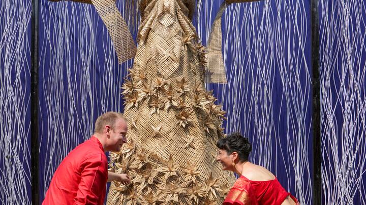 Irish artists Richard Babington (L) and Lisa Sweeney add finishing touches to an idol of Goddess Danu at a community Durga Puja pandal in Kolkata. The Irish embassy collaborated with local organisers to set up a joint Durga Puja pandal this year. (Photo: PTI)