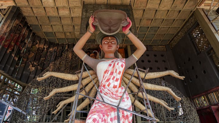 An idol of Goddess Durga inspired by village women at a Sunderban-community-themed Durga Puja pandal in Kolkata. (Photo: PTI)